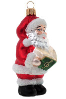 Weihnachtsmann singend mit Gesangbuch