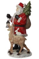 Weihnachtsmann mit Reh und Laterne