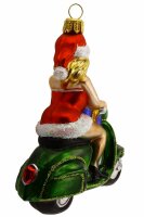 Die Ms. Santa auf dem Motorroller wurde zu einem Symbol für die Freude und den Spaß...